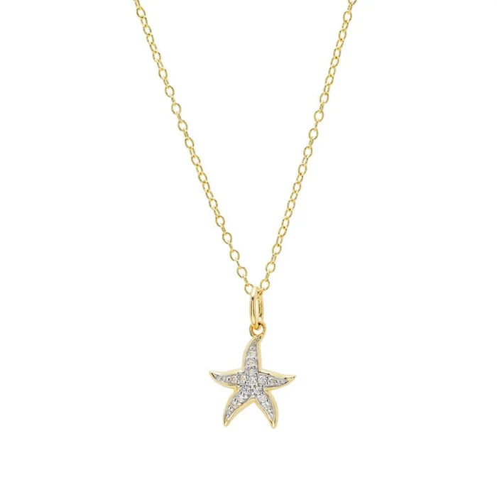 Starfish shaped necklace with diamond accents on a white background