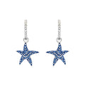 Starfish-shaped earrings adorned with sparkling blue diamonds, showcasing a unique and elegant design.