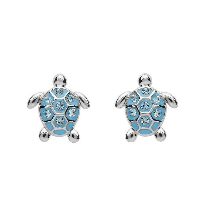A pair of blue turtle earrings featuring intricate designs and a shiny finish, hanging from silver hooks.