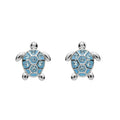 A pair of blue turtle earrings featuring intricate designs and a shiny finish, hanging from silver hooks.