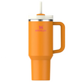 Orange Stanley mug with handle and straw on a white background