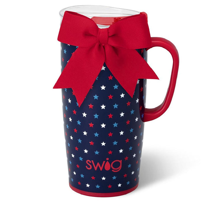 A coffee mug decorated with a red bow and stars, showcasing a festive and cheerful design.