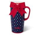A coffee mug decorated with a red bow and stars, showcasing a festive and cheerful design.