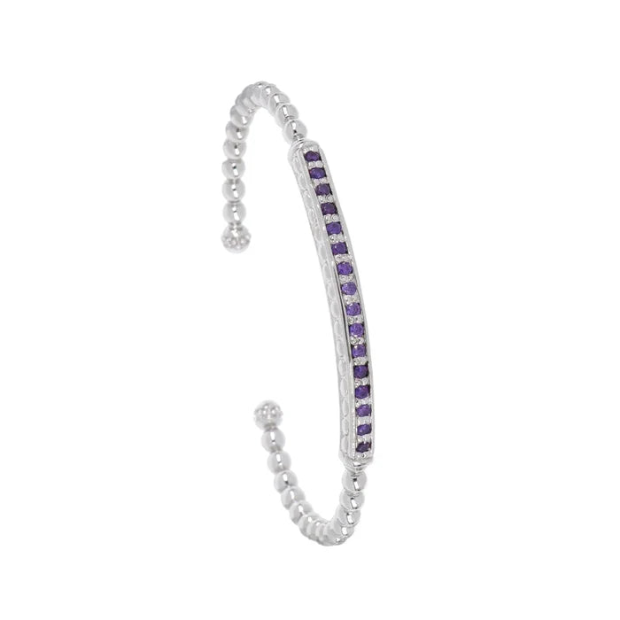This rhodium-finished cuff features a striking pave bar detail that catches the light beautifully