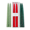 Set of green and red twisted candles with a white box in the center.