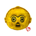 A yellow face toy with eyes set against a solid black background.