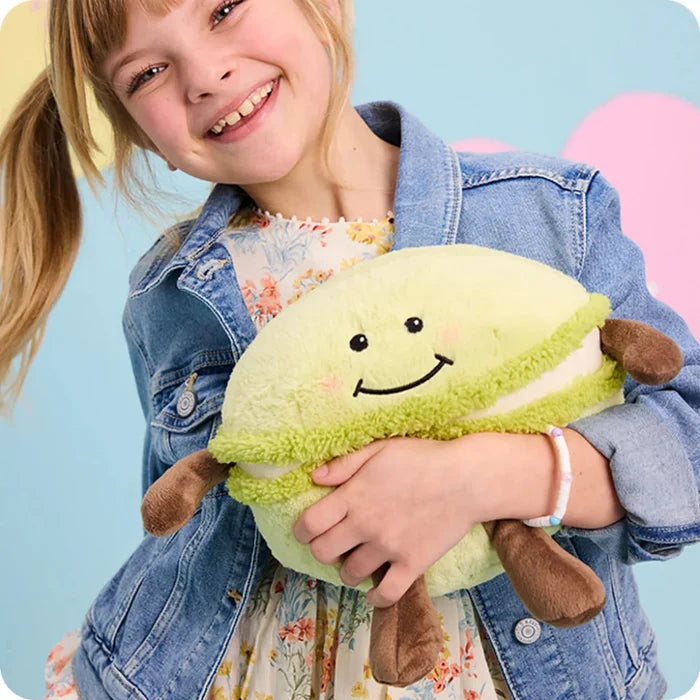 Girl holding Warmies Macaroon
