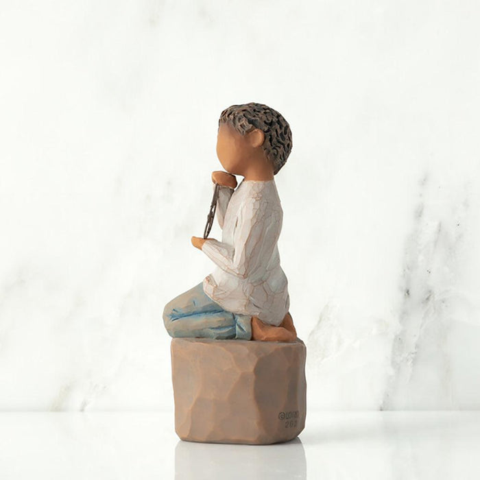 "Willow Tree Love You Too figurine – boy with darker skin kneeling on a pedestal, holding a wire circle that says 'love you' in script."
