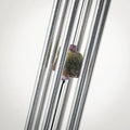 Art glass wind chime with artisan swirl design featuring colorful glass feather accent
