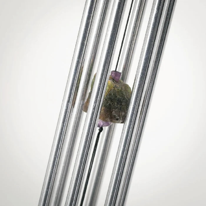 Art glass wind chime with artisan swirl design featuring colorful glass feather accent