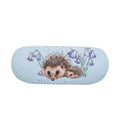 A hedgehog nestled among bluebells on a vibrant blue background, showcasing a serene natural scene.